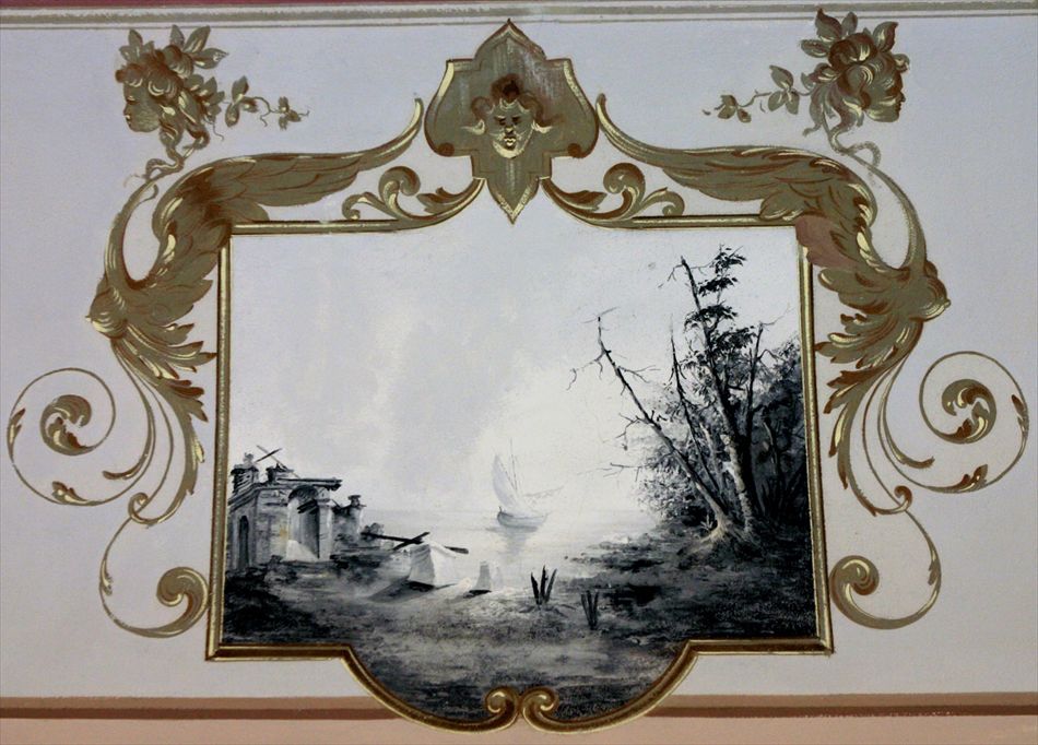 Particolare: la cornice bronzea racchiude il paesaggio 